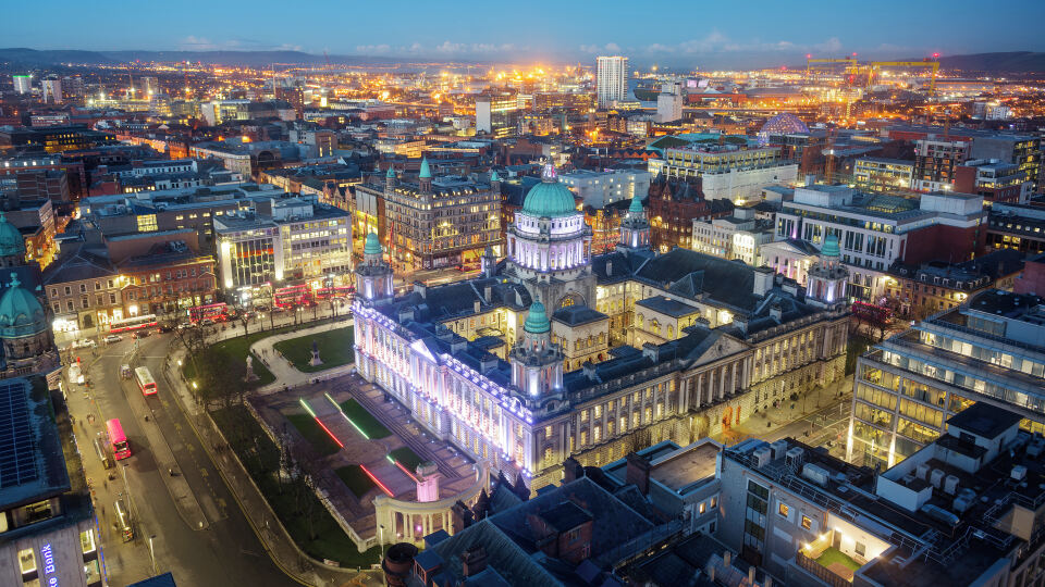 A view of Belfast City  at dusk with Belfast City Hall in the foreground